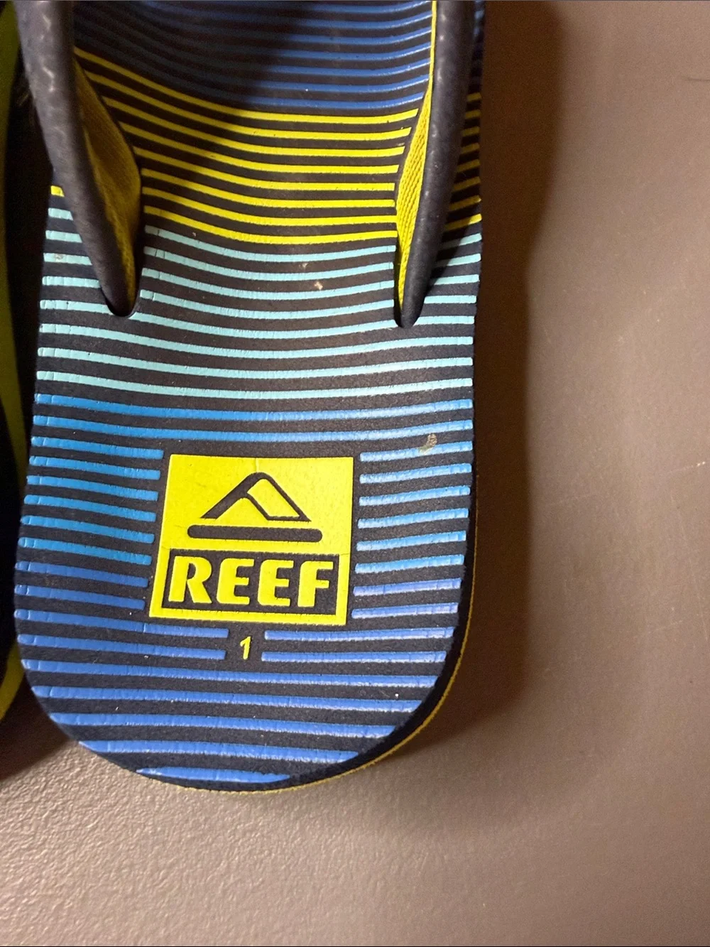 Kid’s Reef Blue & Yellow Striped Flip Flops. Size: 1